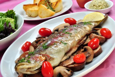 Grilled rainbow trout with some organic mushroom clipart