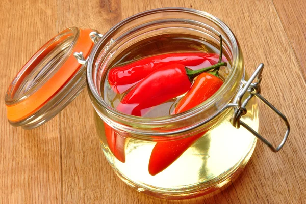 Some organic red paprika in sunflower oil — Stock Photo, Image