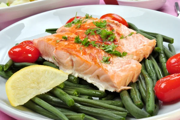 Grilled salmon with organic beans on a plate — Stock Photo, Image