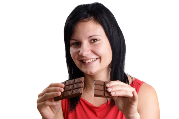 Stock image A young woman holds some sweet chocolate