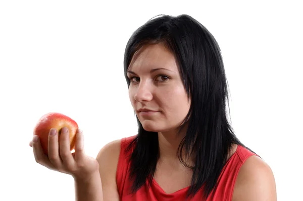 Молодая женщина не любит это яблоко — стоковое фото