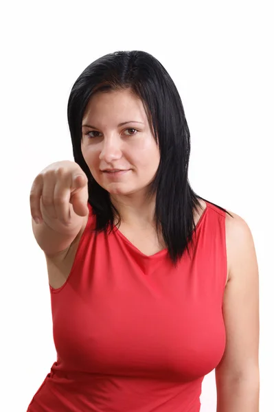 Uma jovem mostra com a ponta do dedo — Fotografia de Stock