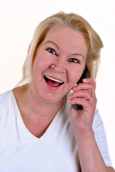 Donna sulla cinquantina con un cellulare — Foto Stock