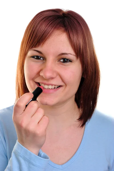 Mujer joven con un lápiz labial rojo en la mano — Foto de Stock