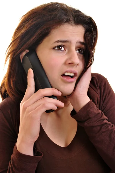Νεαρή γυναίκα μιλάει σε ένα τηλέφωνο — Φωτογραφία Αρχείου