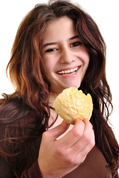 A young woman likes this organic bread roll — Stock Photo, Image