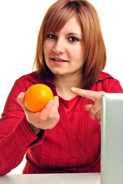 A young woman likes this healthy orange — Stock Photo, Image
