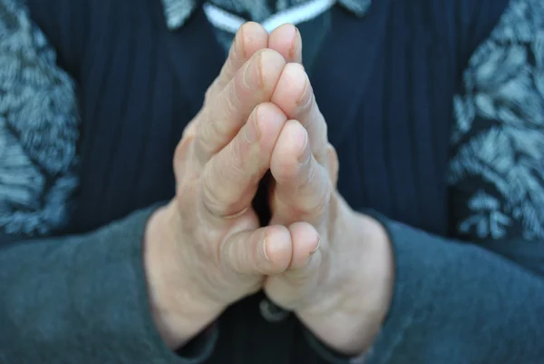 stock image One old person is praying in silence