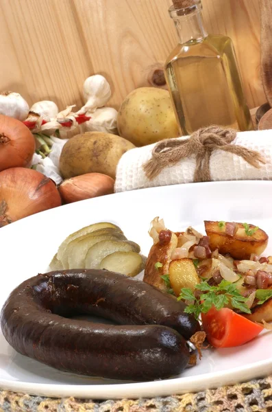 Home made black pudding with grilled potato — Stock Photo, Image