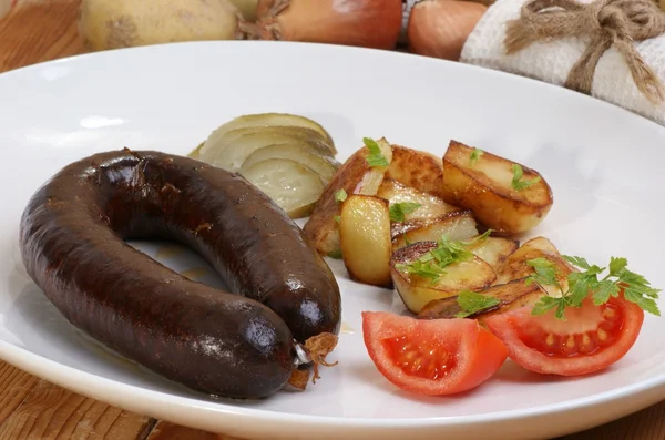 Home made black pudding with grilled potato — Stock Photo, Image