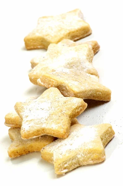 Vanilla cookies in star shape decorated with vanilla sugar — Stock Photo, Image