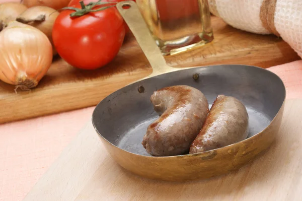 Home made grilled sausage in a brass pan — Stock Photo, Image