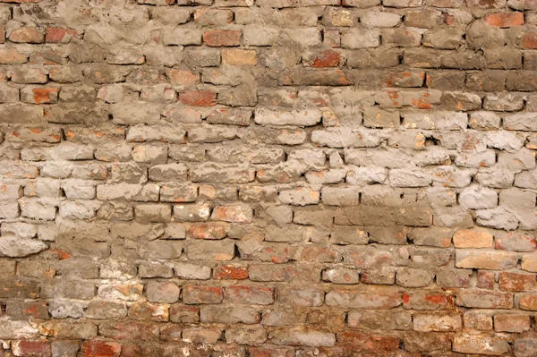 Каменная стена с цементом до штукатурки — стоковое фото