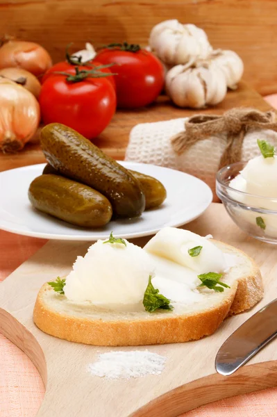 Lard with parsley on home baked bread — Stock Photo, Image