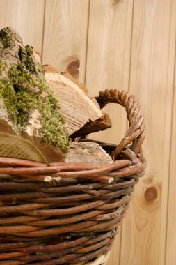 Acacia wood split in a woven basket clipart