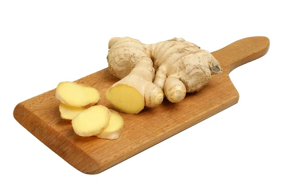 Organic sliced ginger on a wooden board — Stock Photo, Image