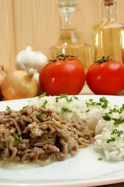 Minced meat with rice on a white plate — Stock Photo, Image