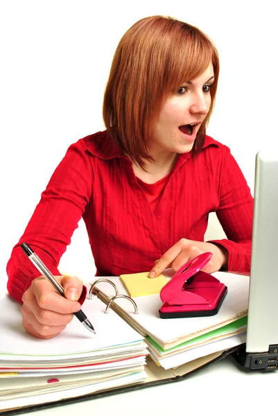 Office assistant in a red blouse makes notes — Stock Photo, Image