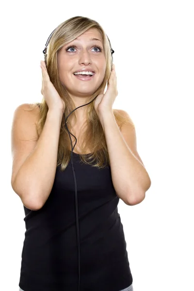 Vrouw die naar muziek luistert en zingt Stockfoto