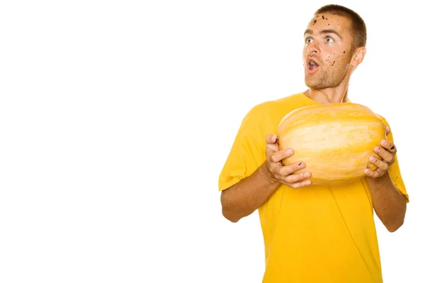 Surprised man with a pumpkin — Stock Photo, Image