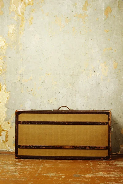 stock image Suitcase on wooden floor