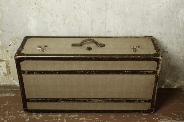Suitcase on wooden floor — Stock Photo, Image