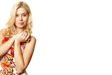 Attractive young woman smiles slyly on a white background clipart