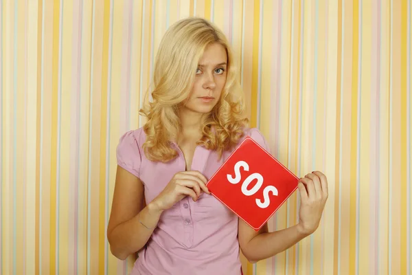 Beautiful Young Woman Room Holding Red Card Text Sos Asking — Stock Photo, Image