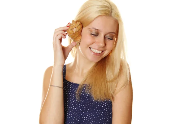 Happy young lady holding a shell — Stock Photo, Image