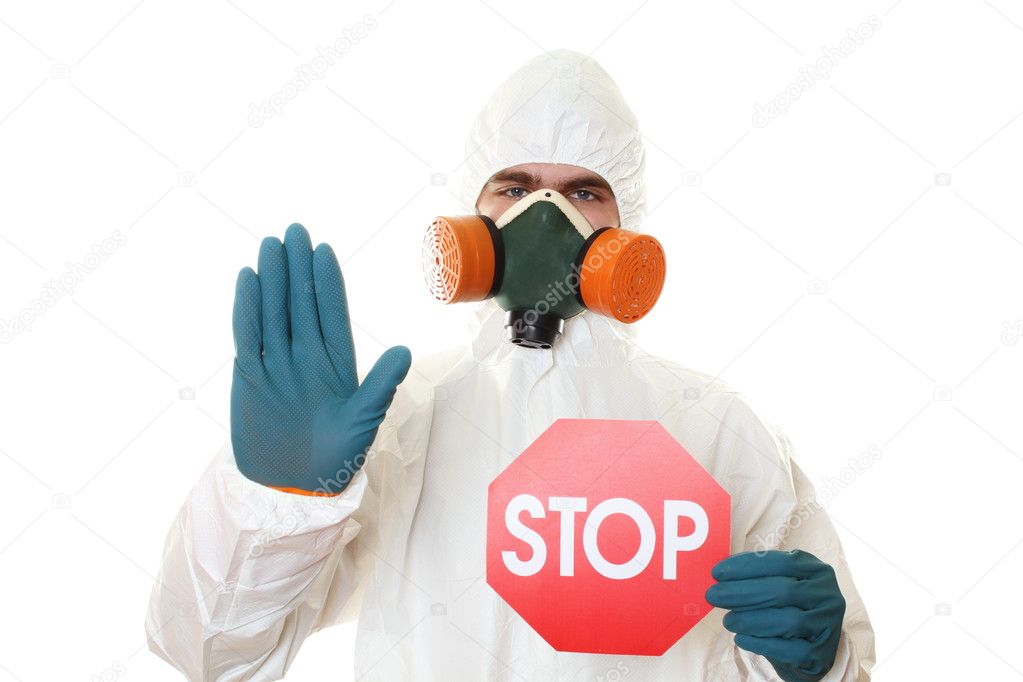 Man in protective suit with a sign STOP
