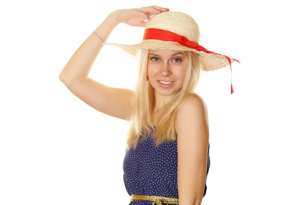 Mooie jonge blonde vrouw in een stro hoed — Stockfoto