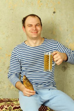 Closeup of a man with a glass of beer clipart