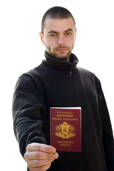 Jonge man bedrijf paspoort — Stockfoto