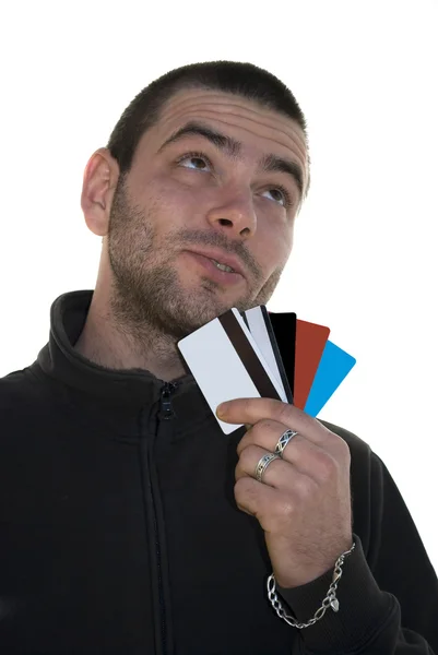 Man met creditcards opzoeken — Stockfoto