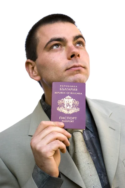Mannen innehar pass tittar upp — Stockfoto