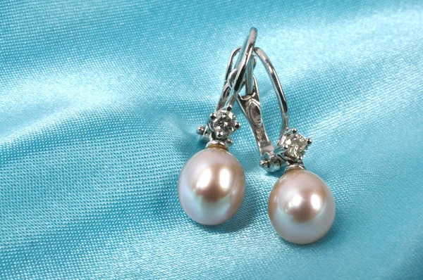 Blue Silk Background Pearls Earrings Micro — Stock Photo, Image