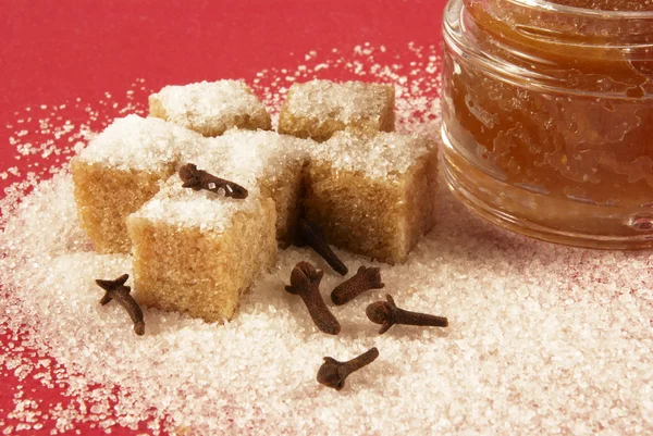 Body Scrub Brown Sugar Crystals Spicinesses Red Background — Stock Photo, Image