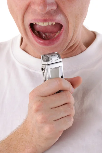 Hombre abre la boca y grita en dictaphone. Primer plano — Foto de Stock