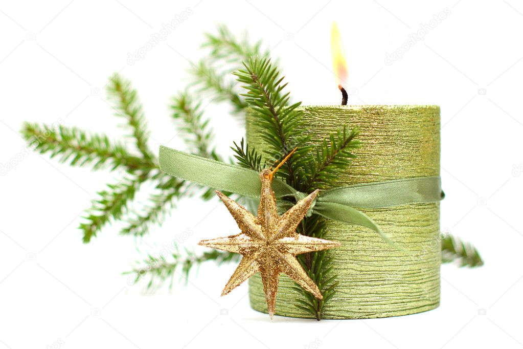 Burn Christmas candle, green ribbon, gold New Year star and spru