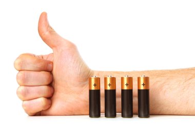 Power concept - battery and male hand with thumb up clipart