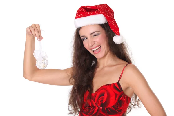 Beautiful girl in the hat of Santa winking — Stock Photo, Image