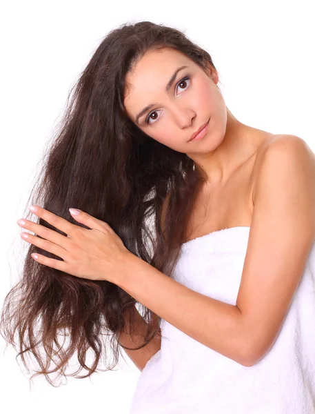 Schöne Frau mit langen Haaren isoliert auf weiß — Stockfoto