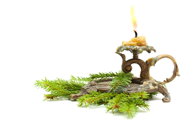 Old candlestick with Christmas fir branch — Stock Photo, Image