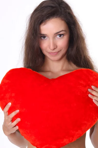 Beautiful female face and red heart close-up — Stock Photo, Image