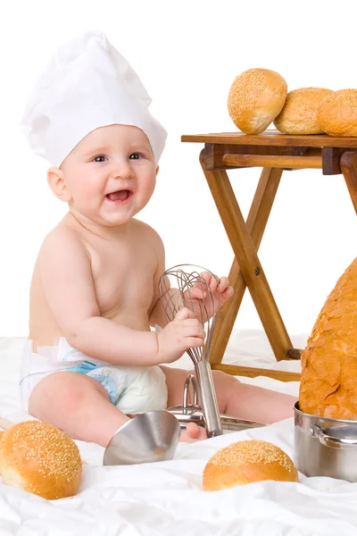 Küçük bebek şef aşçı kostümü ekmek ile — Stok fotoğraf