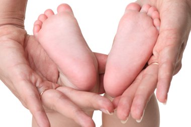 Mother holding baby's feet clipart