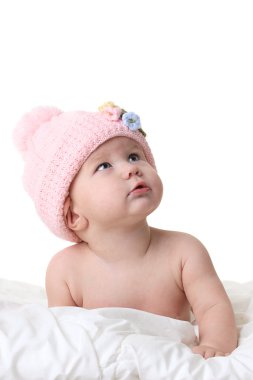 Baby in winter hat looking up