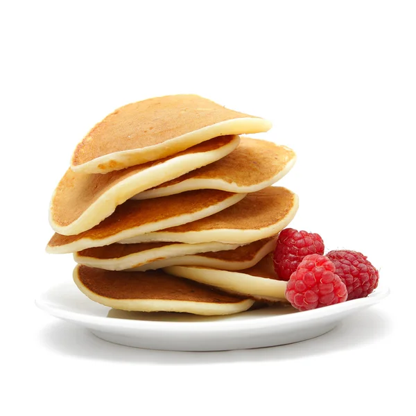 stock image Small pancakes topped with berries isolated on white