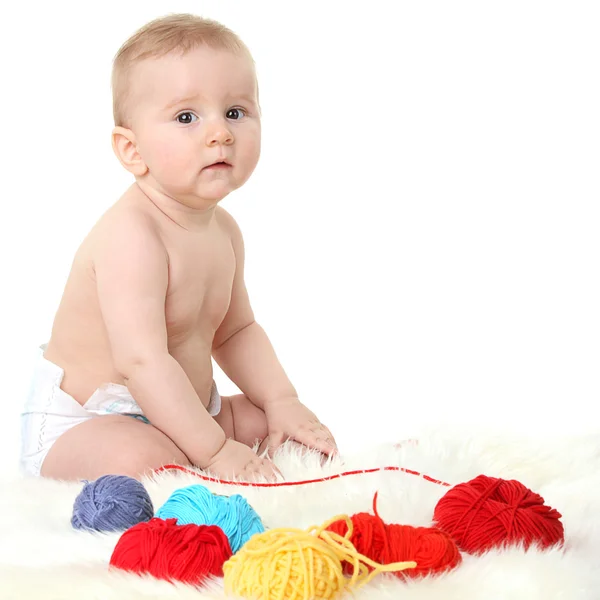 Little baby sitting on a white background — Stock Photo, Image