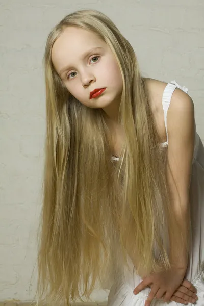 Young girl fashion model with long blond hair — Stock Photo, Image